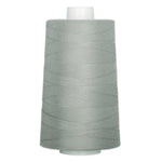 Gray thread wound on white plastic cone spool