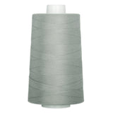 Gray thread wound on white plastic cone spool