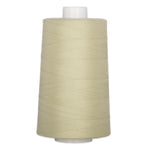 Oyster colored thread wound on a white plastic cone spool