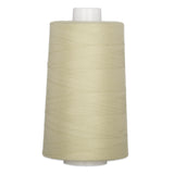 Oyster colored thread wound on a white plastic cone spool