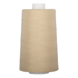 Almond colored thread wound on white plastic cone with neat, even layers visible