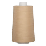 Champagne colored thread wound on a large white plastic cone spool