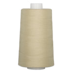 Sandcastle beige thread wound on white plastic cone with neat horizontal wrapping