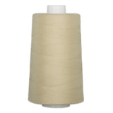 Sandcastle beige thread wound on white plastic cone with neat horizontal wrapping