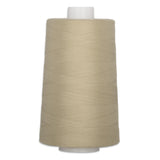Fawn colored thread wound on white plastic cone spool