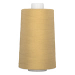 Granola-colored thread wound on white plastic cone, showing smooth polyester thread texture