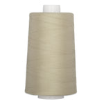 Light oak colored quilting thread wound on white plastic cone spool