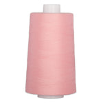 Pink thread wound on white plastic cone spool for quilting and sewing
