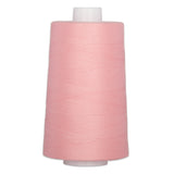 Pink thread wound on white plastic cone spool for quilting and sewing