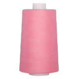 Pink thread on white plastic cone, tightly wound with smooth finish