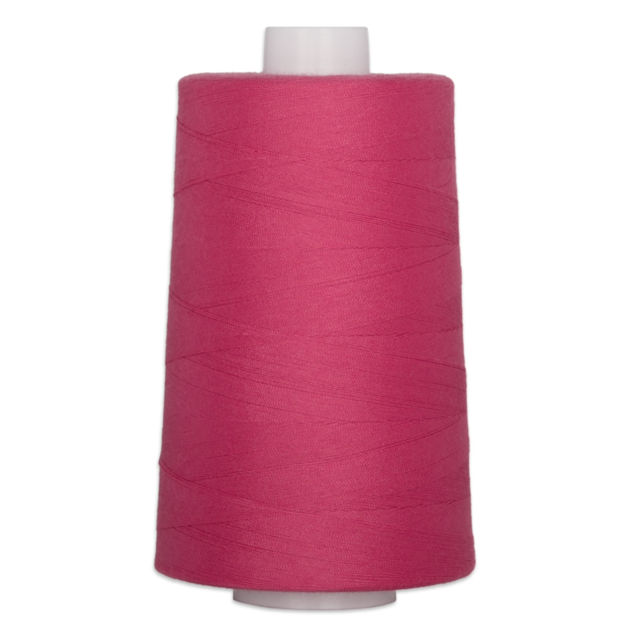 Large cone of dragonfruit pink quilting thread on white spool for sewing and quilting projects.