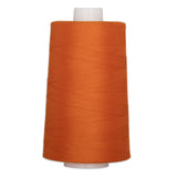 Orange pumpkin colored polyester quilting thread on white cone spool, 40 weight, 6000 yards