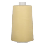 Buttercream yellow polyester quilting thread on large cone spool with white plastic ends