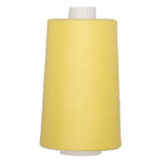 Yellow polyester quilting thread on white cone, 40 weight, 6000 yards