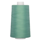 Large cone of seaspray green polyester quilting thread on white plastic cone