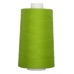Large cone of bright lime green polyester quilting thread on white plastic spool.