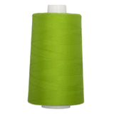 Large cone of bright lime green polyester quilting thread on white plastic spool.