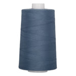 Blue denim polyester quilting thread on large cone spool with white core