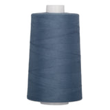 Blue denim polyester quilting thread on large cone spool with white core