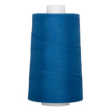 Blue polyester quilting thread on white cone spool, 40 weight, 6000 yards