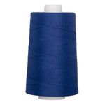 Blue polyester quilting thread on white plastic cone, 40 weight, 6000 yards.