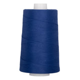 Blue polyester quilting thread on white plastic cone, 40 weight, 6000 yards.