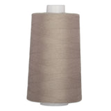 Taupe polyester quilting thread on large white cone spool