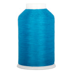 Turquoise thread wound on white plastic cone with smooth, even texture