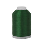 Spool of green thread on a white background