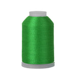 Spool of green thread on a white background