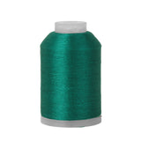 Spool of teal thread on a white background