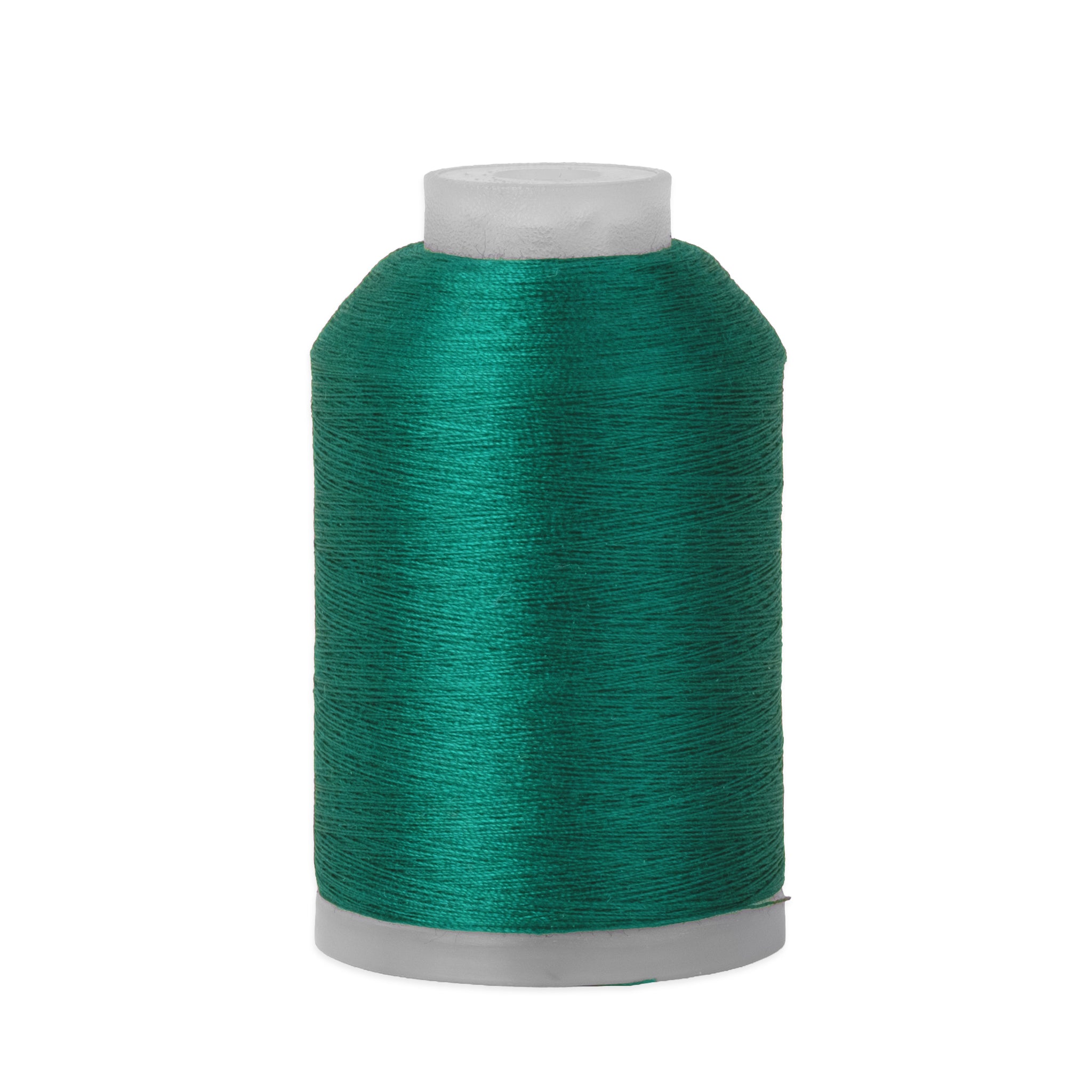Spool of teal thread on a white background