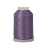 Spool of purple thread on a white background