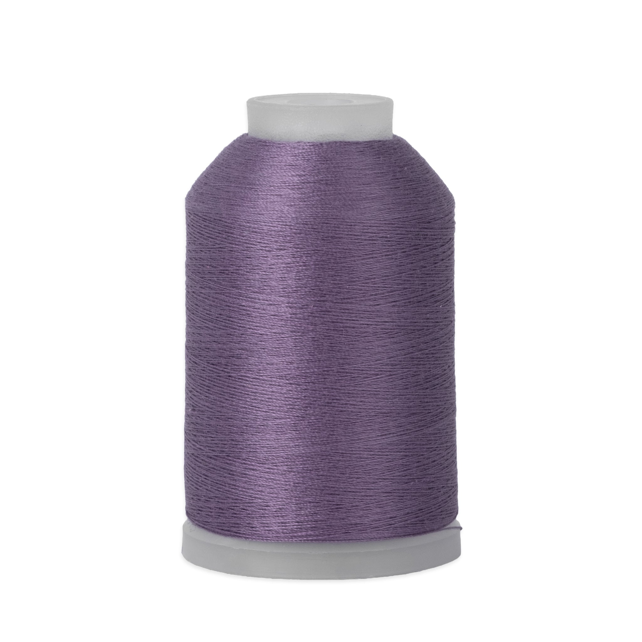 Spool of purple thread on a white background