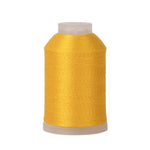 Spool of yellow thread on a white background