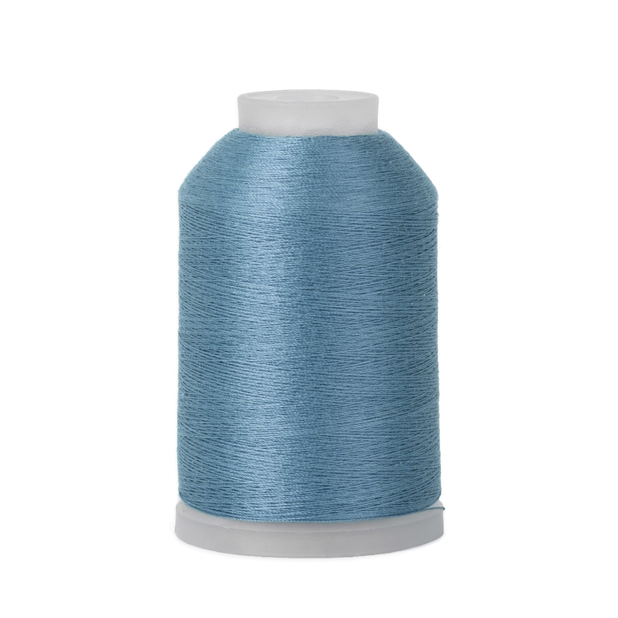 Spool of blue thread on a white background