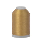 Spool of gold thread on a white background