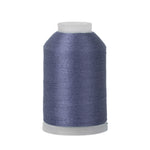 Spool of blue thread on a white background