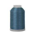 Spool of blue thread on a white background