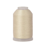 Spool of beige thread on a white background