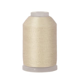 Spool of beige thread on a white background