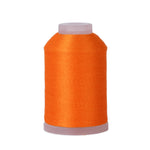 Spool of orange thread on a white background