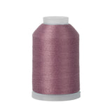 Spool of purple thread on a white background