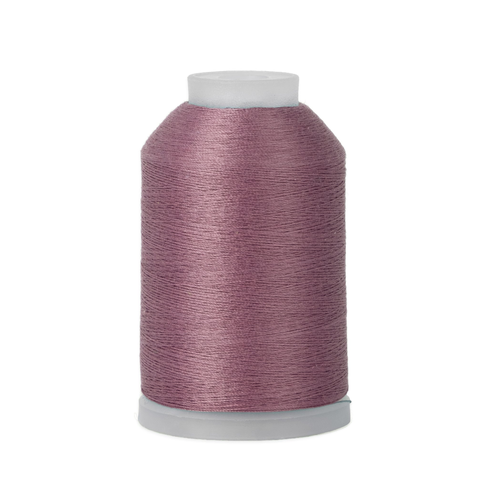Spool of purple thread on a white background