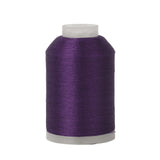 Spool of purple thread on a white background