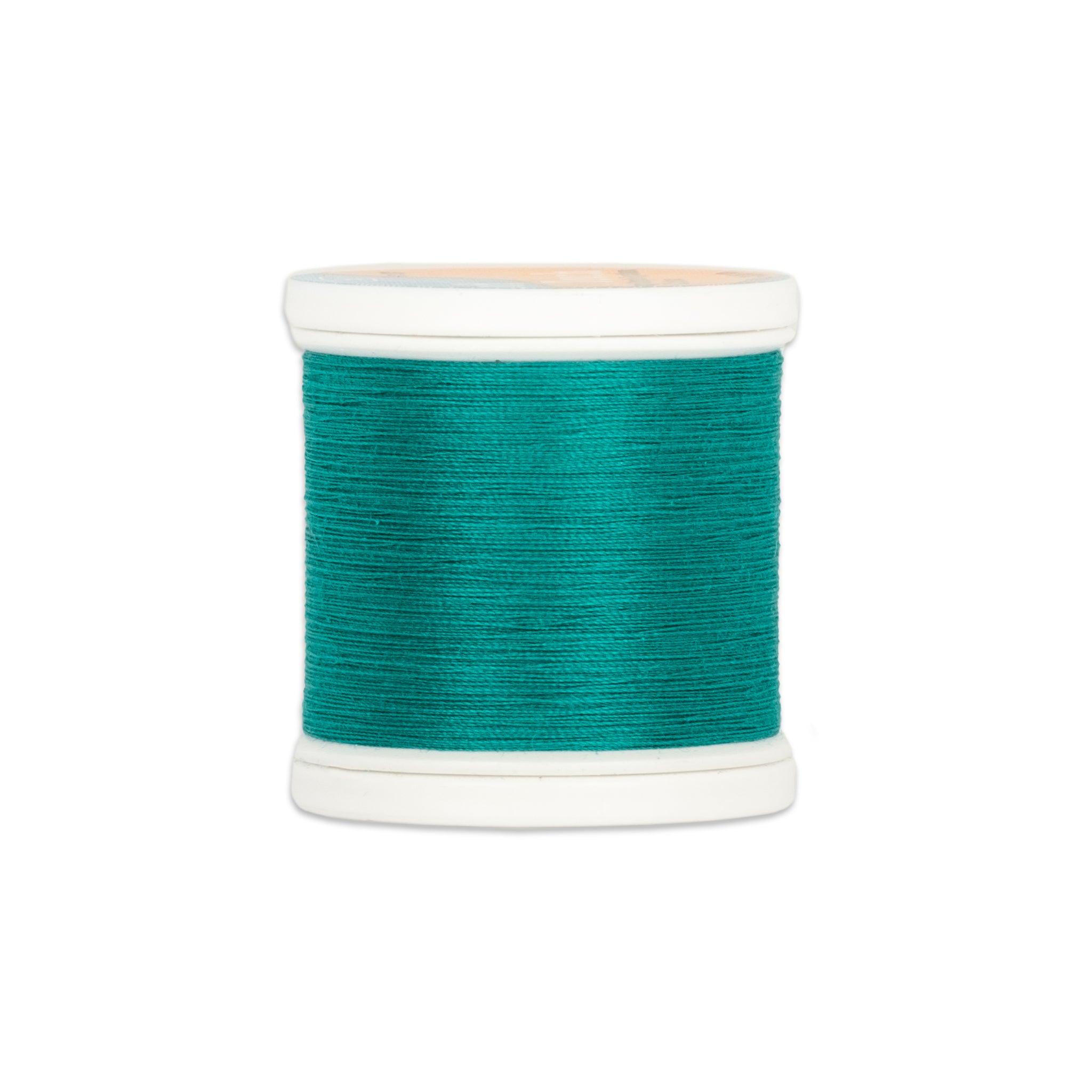Teal green thread wound on white plastic spool with visible thread texture and clean edges