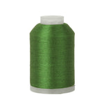Spool of green thread on a white background