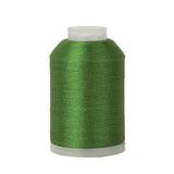 Spool of green thread on a white background