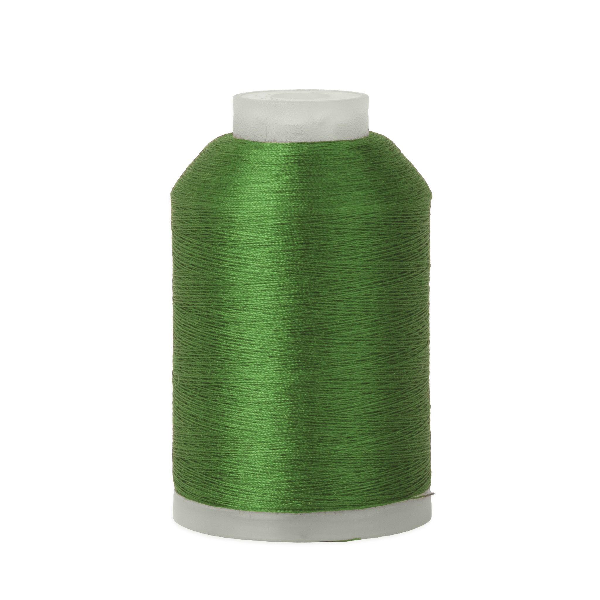 Spool of green thread on a white background