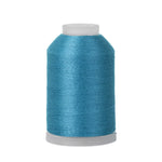 Spool of blue thread on a white background